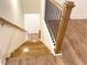 Oak staircase with black metal railing leading to lower floor at 399 Auburn Valley Way, Auburn, GA 30011