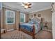 Spacious bedroom with a king-size bed and large windows at 4504 Sterling Pointe Nw Dr, Kennesaw, GA 30152