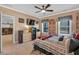 Bedroom with TV, built-in shelving, and window at 4504 Sterling Pointe Nw Dr, Kennesaw, GA 30152