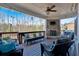 Covered patio with fireplace, seating, and TV at 4504 Sterling Pointe Nw Dr, Kennesaw, GA 30152