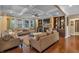 Gathering room with hardwood floors, a fireplace, built-in shelving and a coffered ceiling at 4504 Sterling Pointe Nw Dr, Kennesaw, GA 30152