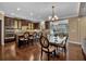 Gourmet kitchen with dark cabinetry, granite countertops, and stainless steel appliances at 4504 Sterling Pointe Nw Dr, Kennesaw, GA 30152