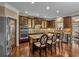 Modern kitchen with double ovens, granite island, and hardwood floors at 4504 Sterling Pointe Nw Dr, Kennesaw, GA 30152