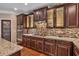 Kitchen features granite countertops and custom cabinetry at 4504 Sterling Pointe Nw Dr, Kennesaw, GA 30152