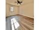 Bright bedroom with vinyl flooring, exterior access, and ceiling fan at 2535 Impala Dr, Cumming, GA 30041