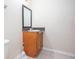 Brown vanity with a sink and mirror at 3103 Snapfinger Ln, Decatur, GA 30034