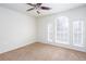 Bedroom with ceiling fan and large windows at 3103 Snapfinger Ln, Decatur, GA 30034