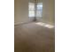 Spacious carpeted bedroom with two windows at 3103 Snapfinger Ln, Decatur, GA 30034