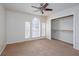 Bedroom with ceiling fan, large closet and neutral carpet at 3103 Snapfinger Ln, Decatur, GA 30034