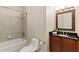 Bathroom with tub, shower, vanity, and dark brown cabinets at 3280 Stillhouse Se Ln # 109, Atlanta, GA 30339