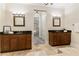 Double vanity bathroom with large mirrors and access to the bedroom at 3280 Stillhouse Se Ln # 109, Atlanta, GA 30339