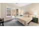 Main bedroom with king-size bed and access to a patio at 3280 Stillhouse Se Ln # 109, Atlanta, GA 30339