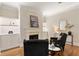 Living room with fireplace, built-in shelving and hardwood floors at 3280 Stillhouse Se Ln # 109, Atlanta, GA 30339