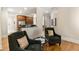 Open living room with hardwood floors and kitchen views at 3280 Stillhouse Se Ln # 109, Atlanta, GA 30339