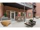 Private patio with brick walls, outdoor seating, and a grill at 3280 Stillhouse Se Ln # 109, Atlanta, GA 30339