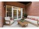 Furnished patio with brick wall and French doors leading inside at 3280 Stillhouse Se Ln # 109, Atlanta, GA 30339