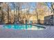 Inviting kidney-shaped swimming pool with brick patio and lounge chairs at 3280 Stillhouse Se Ln # 109, Atlanta, GA 30339