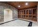 Impressive wine cellar with stone walls and wood cabinets at 3280 Stillhouse Se Ln # 109, Atlanta, GA 30339