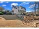 Rear view of house featuring a walk out basement and multi-tiered deck at 416 Telfair Way, Canton, GA 30115