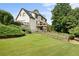 Spacious backyard featuring a walkout basement, a wooden fence, and a deck at 416 Telfair Way, Canton, GA 30115