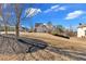 View of the rear of a home with an attached garage in an established neighborhood at 416 Telfair Way, Canton, GA 30115