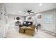 Finished basement with tiled floors, a ceiling fan, and a door leading to the outside at 416 Telfair Way, Canton, GA 30115