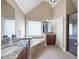 Bathroom featuring dual sinks, a soaking tub, walk in shower and granite countertops, creating a spa-like experience at 416 Telfair Way, Canton, GA 30115