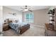 Bedroom with a window, fan, bed, guitar decor, neutral walls and carpeted floor providing a welcoming atmosphere at 416 Telfair Way, Canton, GA 30115