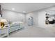 Bedroom with a double bed, neutral carpet, and a glimpse of the living area through a doorway at 416 Telfair Way, Canton, GA 30115