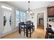 Cozy breakfast nook with natural light and access to outdoor living space and a view to the laundry room at 416 Telfair Way, Canton, GA 30115