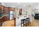 Spacious kitchen featuring granite countertops, bar seating, and stainless steel appliances at 416 Telfair Way, Canton, GA 30115