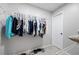 Walk-in closet with metal shelving and hanging clothes, providing ample storage space at 416 Telfair Way, Canton, GA 30115