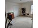 Spacious bedroom with a queen-size bed and carpeted floor at 7413 Melhana Ln, Union City, GA 30291