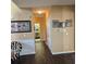 Long hallway with dark hardwood floors and neutral walls at 7413 Melhana Ln, Union City, GA 30291