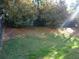 Landscaped backyard with lush green grass at 6053 Hemperly Rd, Atlanta, GA 30349