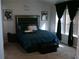 Spacious bedroom with teal bedding and large windows at 6053 Hemperly Rd, Atlanta, GA 30349