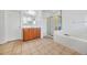 Bathroom with double sinks, shower, and tile floors at 4740 Eagles Ridge Loop, Stonecrest, GA 30038