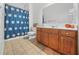 Clean bathroom, featuring a shower/tub combo, wood vanity, and tile floors at 4740 Eagles Ridge Loop, Stonecrest, GA 30038