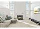 Gathering room with a large sectional sofa and fireplace at 4740 Eagles Ridge Loop, Stonecrest, GA 30038