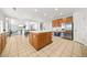 Kitchen island with wood cabinets and tile floor at 4740 Eagles Ridge Loop, Stonecrest, GA 30038