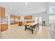 Eat-in kitchen with island, wood cabinets, and tile floors at 4740 Eagles Ridge Loop, Stonecrest, GA 30038