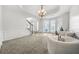Light and airy living room with bay windows and seating area at 4740 Eagles Ridge Loop, Stonecrest, GA 30038