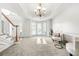 Spacious living room with bay windows and chandelier at 4740 Eagles Ridge Loop, Stonecrest, GA 30038