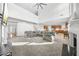 Open concept living room with views into the kitchen and fireplace at 4740 Eagles Ridge Loop, Stonecrest, GA 30038