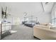 Main bedroom with a king bed, sitting area, and large windows at 4740 Eagles Ridge Loop, Stonecrest, GA 30038
