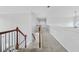 Upstairs hallway with carpeted floors and staircase at 4740 Eagles Ridge Loop, Stonecrest, GA 30038