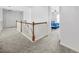 Upstairs hallway with carpet and a view into bedroom at 4740 Eagles Ridge Loop, Stonecrest, GA 30038