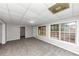Finished basement with gray carpet and multiple windows at 730 Pinehurst Dr, Fairburn, GA 30213