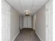 Long basement hallway with neutral walls and carpeting at 730 Pinehurst Dr, Fairburn, GA 30213