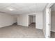 Spacious finished basement with neutral carpeting and ample natural light at 730 Pinehurst Dr, Fairburn, GA 30213